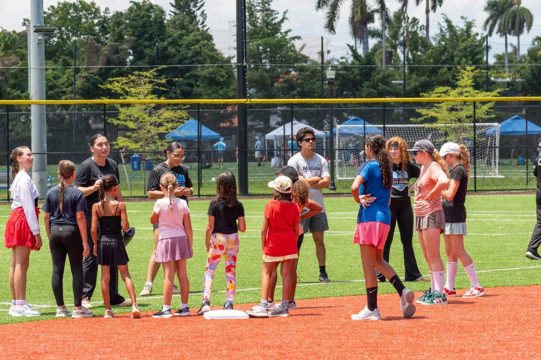 Girls and female coaches gathered for a softball clinic